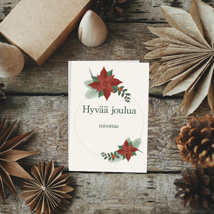 Kortti joulutähdillä ja tekstillä Hyvää joulua, maassa puulattialla